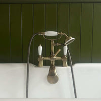 Downton bath shower mixer tap with white ceramic levers - antique brass