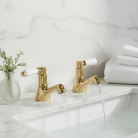 Downton hot and cold basin taps with white ceramic levers - gold
