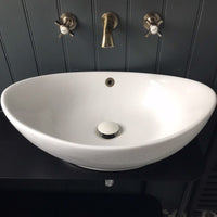 Pop up basin waste with ceramic cap round slotted - white