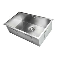 Single-bowl stainless steel kitchen sink with sleek, brushed finish and centered drain for modern kitchens