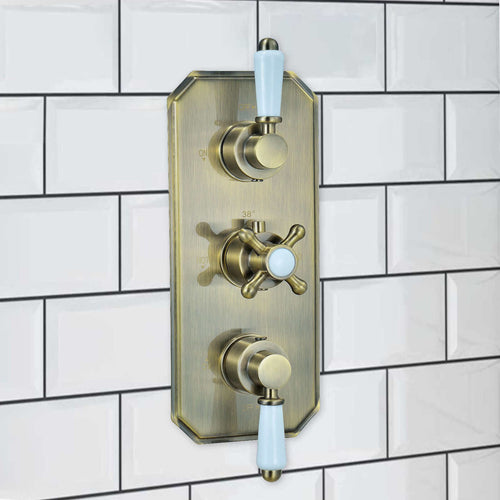 Buy Regent traditional crosshead and white lever concealed thermostatic triple shower valve with 2 outlets - antique brass online UK
